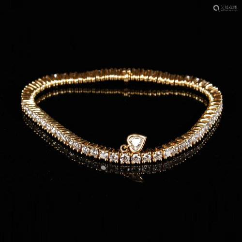 18k gold bracelet with brilliant cut diamonds.