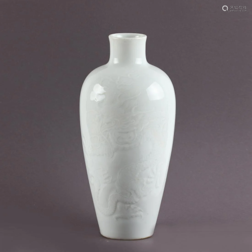 A Chinese White Glazed Vase with Dragon Pattern
