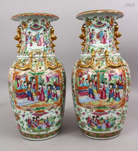 A PAIR OF 19TH CENTURY CHINESE CANTON FAMILLE ROSE PORCELAIN VASES, the white ground with panel