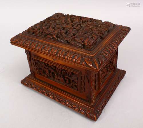 A GOOD 19TH CENTURY CHINESE CANTON CARVED WOODEN CASKET, the top carved with typical canton scenes