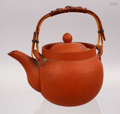 A GOOD CHINESE YIXING CLAY TEAPOT, with carved decoration of landscapes, the base signed, 15cm