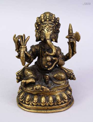 A SMALL 19TH / 20TH CENTURY INDIAN BRONZE FIGURE OF GANESH, in a seated position holding multiple