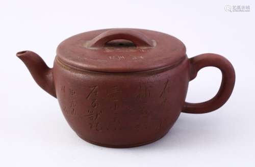 A CHINESE YIXING CLAY CALLIGRAPHY TEA POT, the body of the pot with carved calligraphy, also to