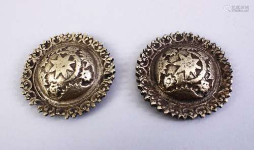 TWO OTTOMAN OR INDIAN WHITE METAL SHIELD SHAPED BOSSES, 5.5cm diameter each.