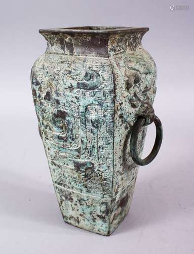 A CHINESE ARCHAIC STYLE BRONZE TWIN HANDLE VASE, with twin moulded ring handles, and carved body