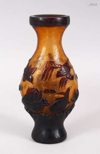 A CHINESE PEKING AMBER GLASS OVERLAID VASE, with birds carp and lotus, base with a seal mark, 17cm.