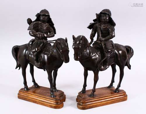 A PAIR OF JAPANESE BRONZE SAMURAI WARRIORS UPON HORSEBACK, once censers, on wooden bases, 30cm x