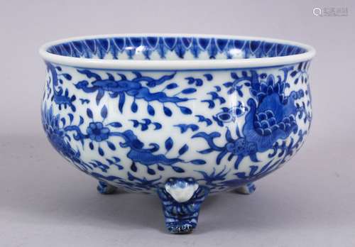 A JAPANESE MEIJI PERIOD BLUE & WHITE TRIPOD BOWL, decorated with an interior scene of a village, the