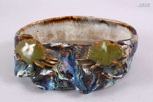 A JAPANESE STUDIO POTTERY CRAB BRUSH WASHER, with a flambeau style glaze, with two crabs climbing