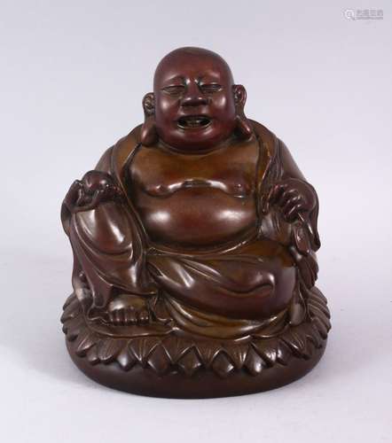 A CHINESE BRONZER C AST FIGURE OF BUDDHA HOLDING A PEACH, seated upon a lotus base. 17cm high.