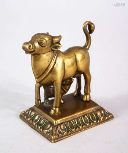 A 18TH / 19TH CENTURY INDIAN BRONZE COW NANDI FIGURE, the cow stood with young 9cm high x 8.5cm