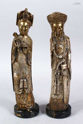 A PAIR OF 19TH / 20TH CENTURY GILT WHITE METAL FIGURES OF EMPEROR AND EMPRESS, both depicted wearing