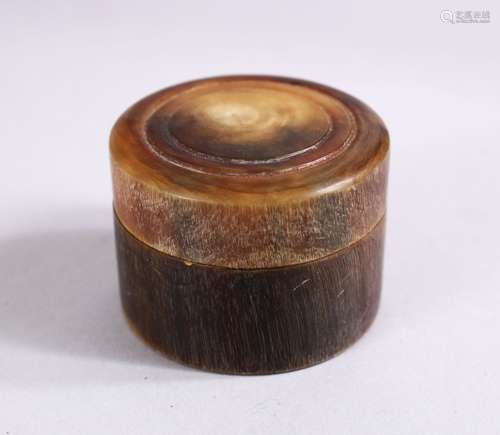 A 19TH CARVED RHINOCEROS HORN TURNED LIDDED BOX, 4.5cm.