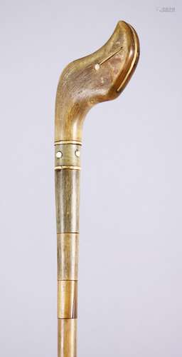 A 19TH CENTURY RHINOCEROS HORN CARVED WALKING STICK, wholly made up of horn, sectional body, ivory