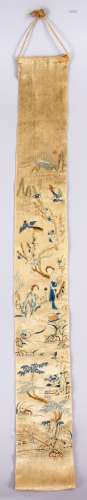 A 19TH CENTURY CHINESE EMBROIDERED SILK TEXTILE, depicting figures and birds amongst a waterside