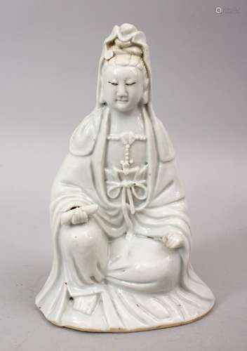 A 19TH CENTURY CHINESE BLANC DE CHINE PORCELAIN FIGURE OF GUANYIN, in a seated position holding a