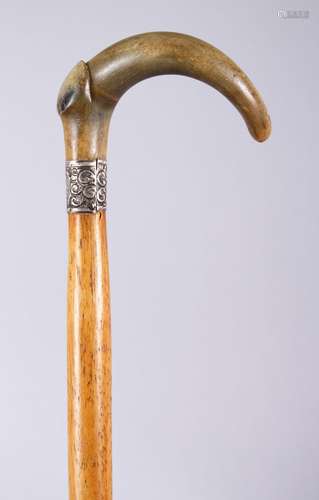 A 19TH CENTURY RHINOCEROS HORN HANDLED MALACCA WALKING STICK, 91cm.