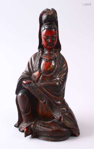 A 19TH CENTURY CHINESE CARVED WOOD & LACQUER FIGURE OF GUANYIN, in a seated position, with carved