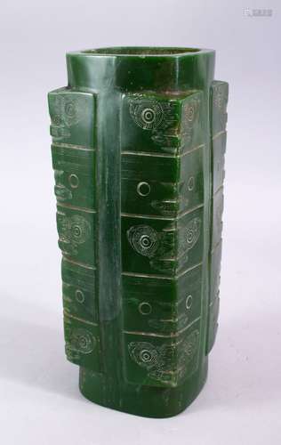 A CHINESE CARVED JADE STYLE ARCHAIC CONG VASE, with carved archaic decoration, 29.5cm high.