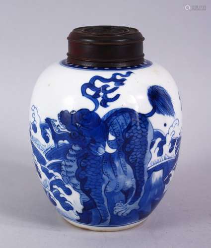 A CHINESE KANGXI BLUE & WHITE PORCELAIN GINGER JAR & WOOD COVER, with decoration a dragon and