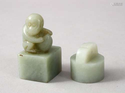 TWO GOOD CHINESE CARVED JADE SEALS, one depicting a monkey crouched amongst his nut, the base carved