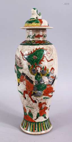 A 19TH CENTURY CHINESE CRACKLE GLAZED FAMILLE VERTE PORCELAIN WARRIOR VASE & COVER, decorated with