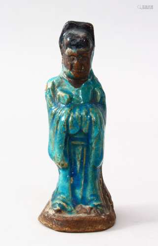 A GOOD EARLY CHINESE MING FIGURE OF A GENERAL, the figure glazed with turquoise, 14cm high,