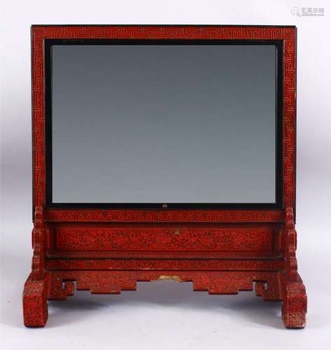 A FINE 19TH CENTURY CHINESE CINNABAR LACQUER SHOU DECORATED TABLE MIRROR, the mirror finely carved