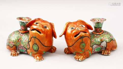 A GOOD PAIR OF 19TH CENTURY CHINESE CANTON FAMILLE ROSE PORCELAIN JOSS STICK HOLDERS, both lion dogs