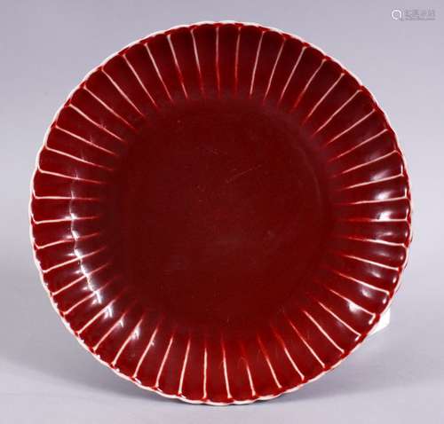 A CHINESE MING STYLE COPPER RED PORCELAIN RIBBED DISH, 21.5cm the base with a six character mark.