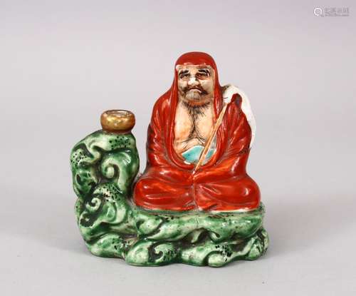 A GOOD JAPANESE MEIJI PERIOD KUTANI PORCELAIN JOSS STICK HOLDER, of a seated arhat with his