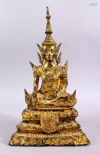 AN 18TH / 19TH CENTURY THAI GILT BRONZE FIGURE OF BUDDHA, seated in meditation upon lotus formed