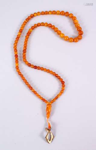 A FINE SET OF 19TH CENTURY QING DYNASTY CARVED AMBER BEAD NECKLACE / ROSARY BEADS, comprising 101