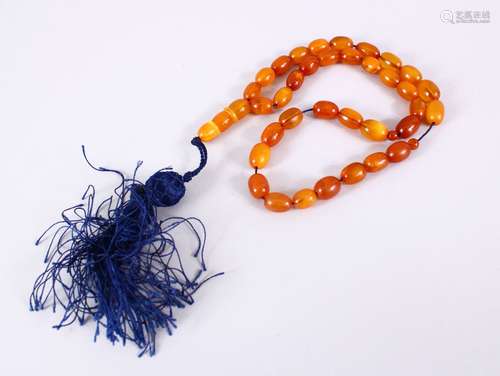 A FINE SET OF CHINESE QING DYNASTY CARVED AMBER BEAD NECKLACE / ROSARY BEADS, comprising 37 carved