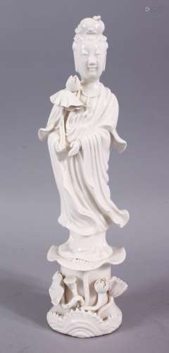 A CHINESE BLANC DE CHINE FIGURE OF GUANYIN, stood in an elegant position upon lotus holding a