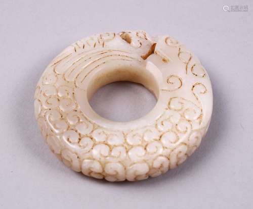 A GOOD CHINESE CARVED WHITE JADE PHOENIX BI DISK PENDANT, carved with chilong, 6cm.