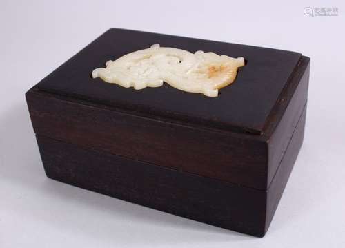 A CHINESE WHITE JADE MOUNTED HARDWOOD BOX, The jade carved in chilong form, 15cm wide x 10cm.