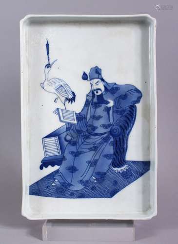 A 20TH CENTURY CHINESE BLUE & WHITE PORCELAIN IMMORTAL TRAY, seated at throne, with a crane, 28cm