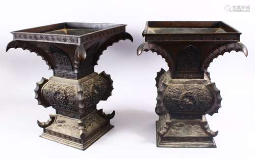 A LARGE & HEAVY PAIR OF JAPANESE BRONZE RELIEF DRAGON VASES, carved in relief with dragons and