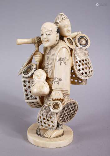 A JAPANESE MEIJI PERIOD CARVED IVORY FIGURE OF A BASKET SELLER, the man stood holding his baskets