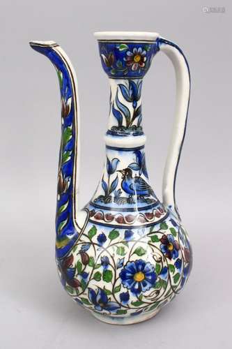 A 19TH CENTURY PERSIAN QAJAR GLAZED POTTERY EWER, with floral decoration, 28.5cm.