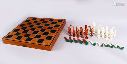 A GOOD 19TH CENTURY CHINESE CARVED & STAINED IVORY CHESS SET, with a folding storage board for the