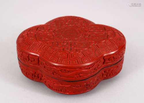 A 20TH CENTURY CHINESE CARVED CINNABAR LACQUER BOX & COVER, carved to depict formal rosette and