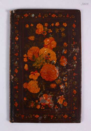 A GOOD 19TH CENTURY PERSIAN LACQUER PAINTED BOOK COVER, depicting native floral spray, 20cm x 12cm