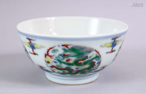 A CHINESE YONGZHENG STYLE DOUCAI DRAGON PORCELAIN RICE BOWL, decorated with roundel of dragons