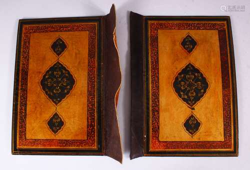 A GOOD 19TH CENTURY PERSIAN LACQUER BOOK COVERS, painted with bands of calligraphy and floral