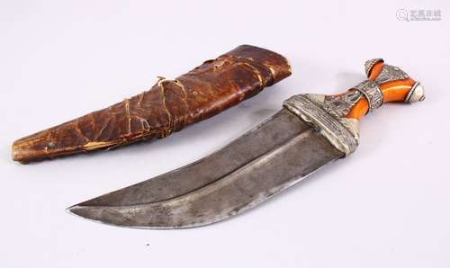 A 19TH CENTURY ARAB JAMBIYA DAGGER WITH AMBER COLOUR BAKELITE HILT, with a leather scabbard, and