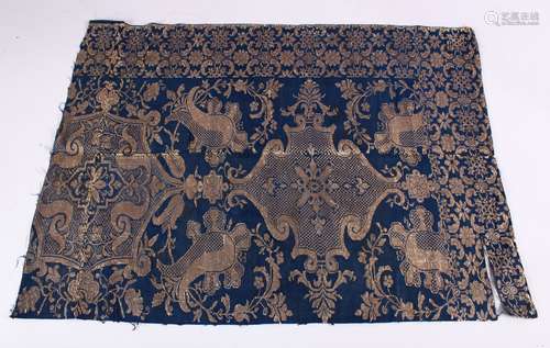 A RARE ISLAMIC EMBROIDERED TEXTILE FRAGMENT, on blue ground with gold colour embroidery.