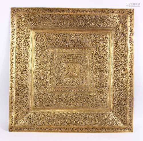 A LARGE 19TH CENTURY SRI LANKAN ENGRAVED BRASS TRAY - Profusely carved with floral decoration 62cm x