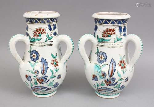 A PAIR OF IZNIK STYLE POSS EUROPEAN POTTERY TRIPLE HANDLED VASES, each vase with three moulded